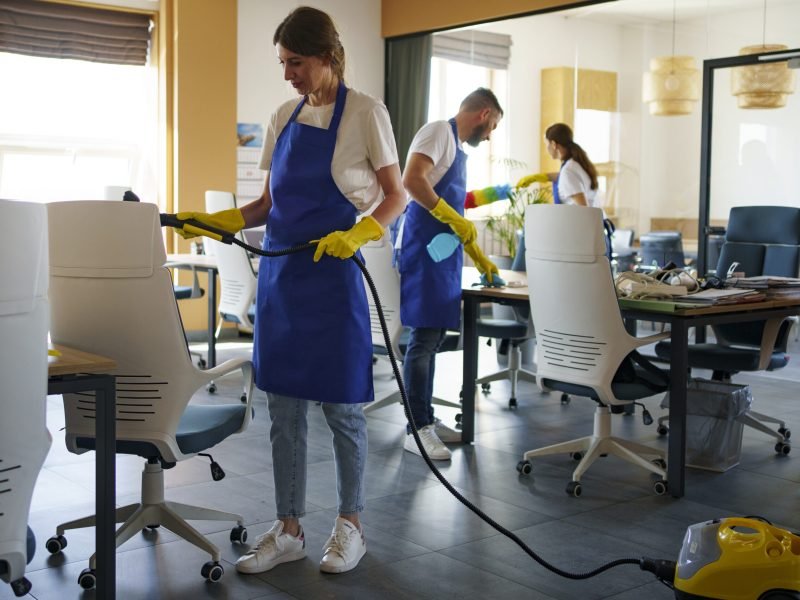 professional-cleaning-service-person-using-vacuum-cleaner-office professional-cleaning-service-person-using-vacuum-cleaner-office